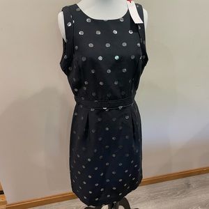 Woman’s black dress with silver polka dots